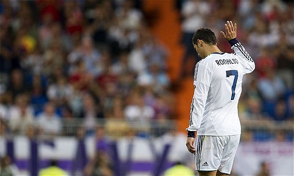 Real Madrid's Portuguese forward Cristia...Real Madrid's Portuguese forward Cristiano Ronaldo gestures as he leaves the pitch during the Spanish League football match Real Madrid vs Granada on September 2, 2012 at the Santiago Bernabeu stadium in Madrid.   AFP PHOTO/ DANI POZODANI POZO/AFP/GettyImages