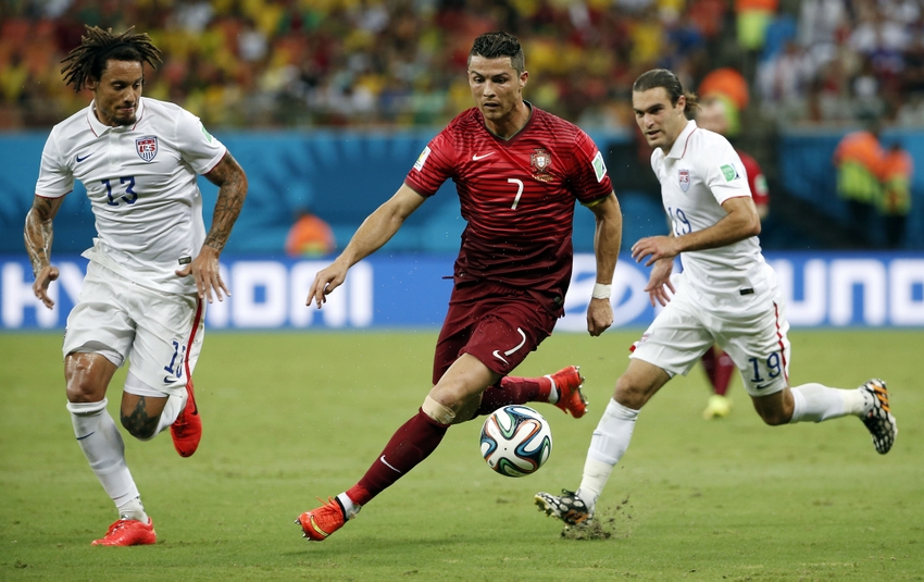 Jun 22, 2014; Manaus, Amazonas, BRAZIL; Portugal forward Cristiano Ronaldo (7) cuts between United States midfielder Jermaine Jones (13) and United States midfielder Graham Zusi (19) during the second half of a 2014 World Cup game at Arena Amazonia. Mandatory Credit: Winslow Townson-USA TODAY Sports