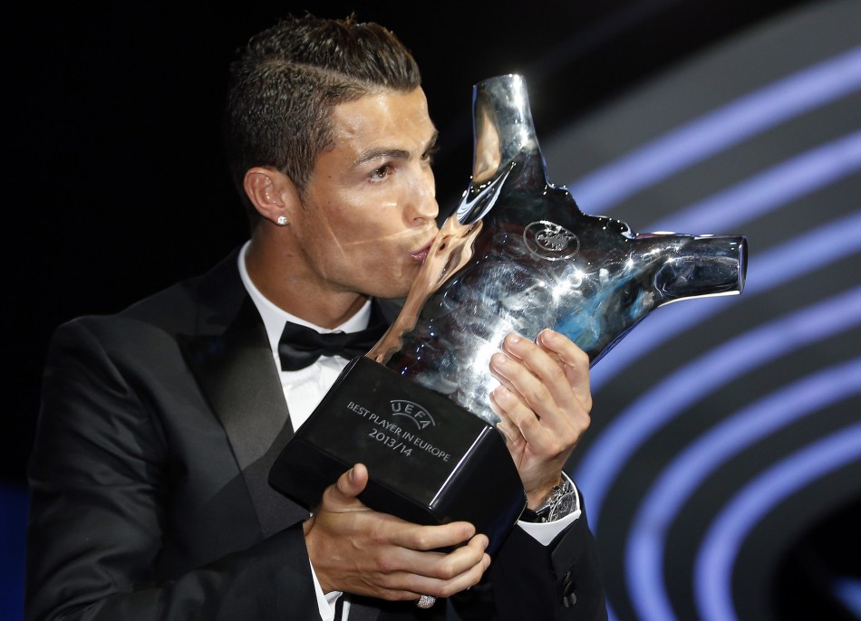 450908-real-madrids-cristiano-ronaldo-kisses-his-best-player-uefa-2014-award-