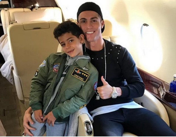 WOW!! Cristiano Ronaldo takes Cristiano Jr away for Christmas break on his private jet!