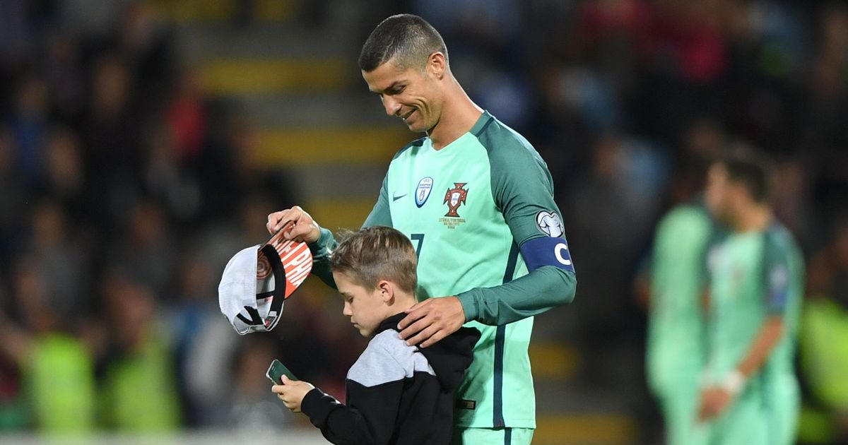 Ronaldo Poses with Kid Pitch Intruder After Portugal Wins vs Latvia